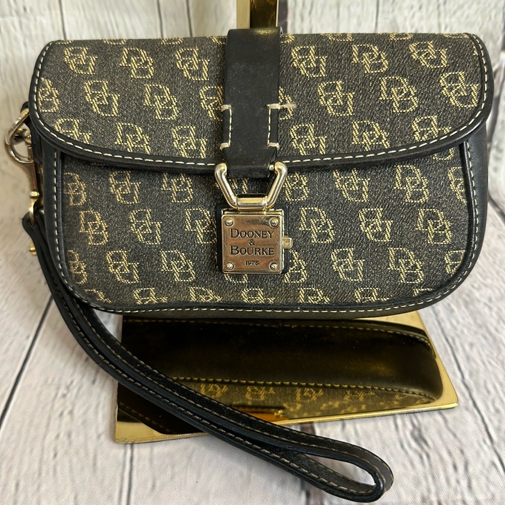 Dooney & Bourke lock flap wristlet